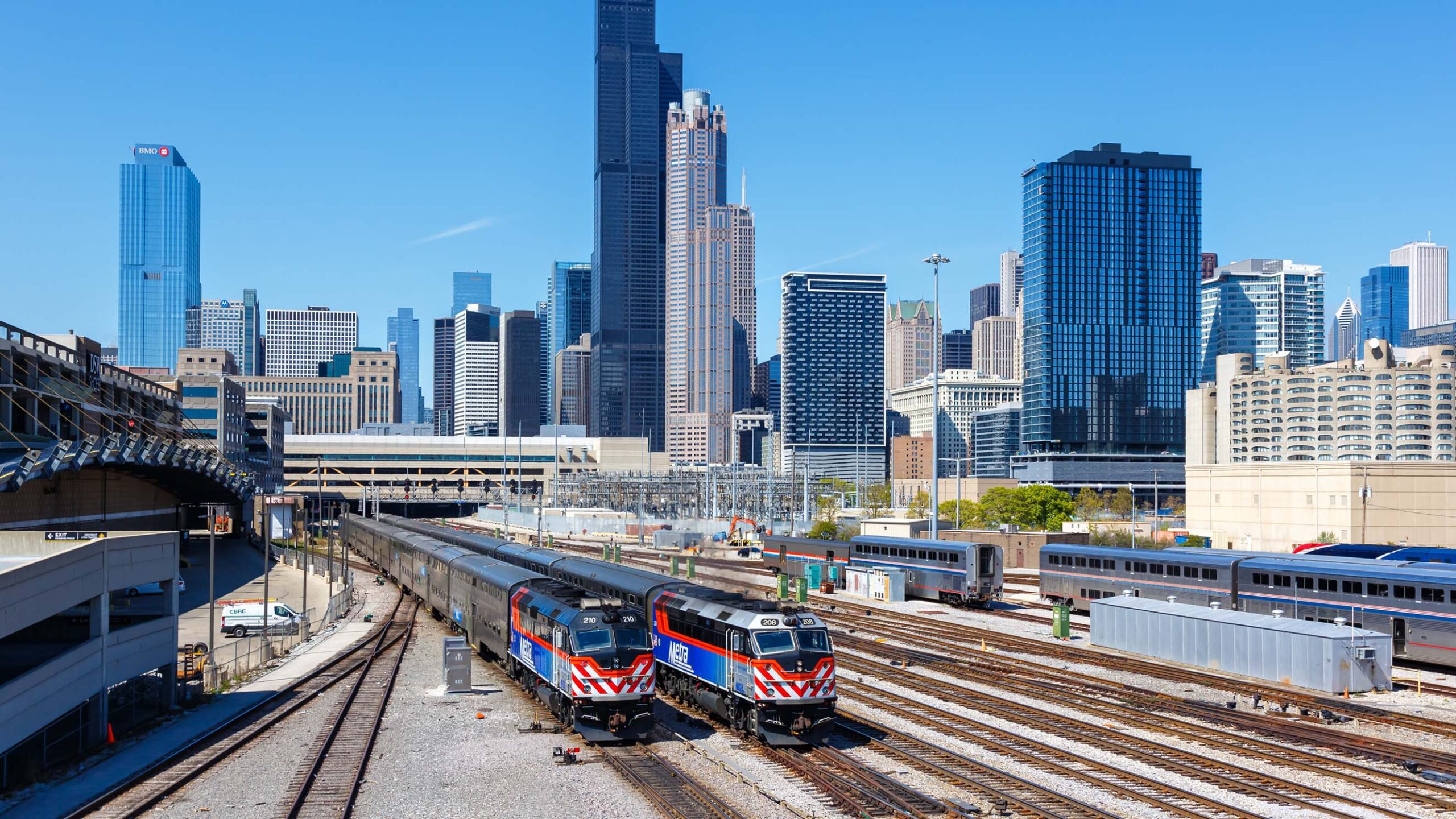 Metra trains in front of Chicago skyline