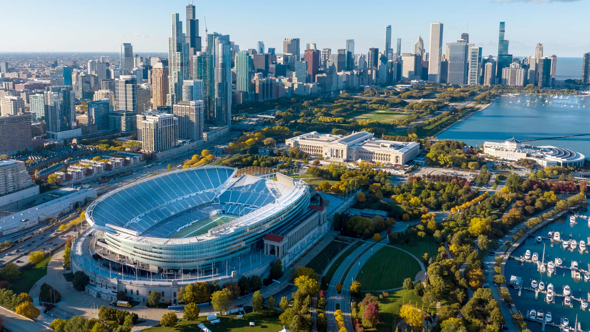 Aerial view of Soldier Field with the Chicago skyline in the background