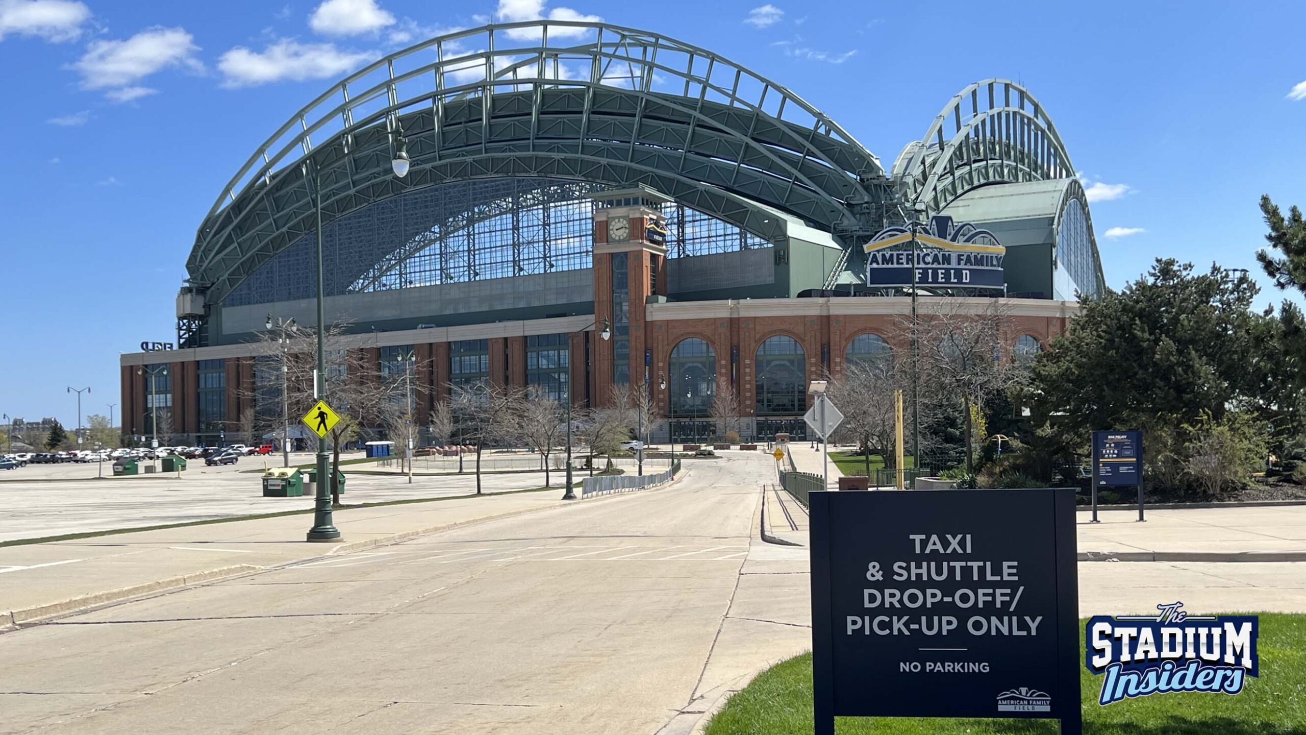 A sign outside American Family Field denotes the shuttle and taxi pickup location