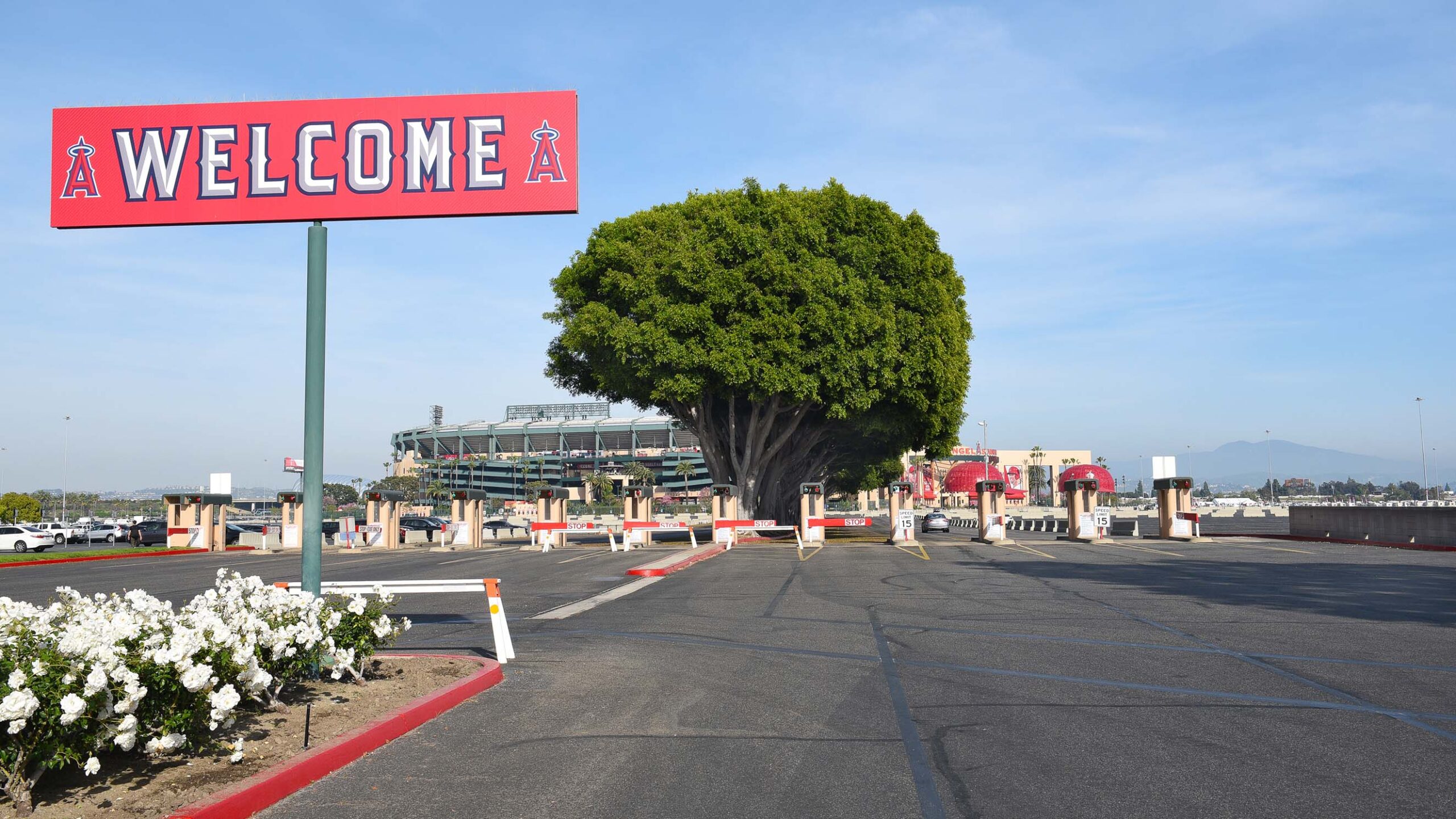 A welcome sign shags over Angel Stadium's parking lot at the State College entrance