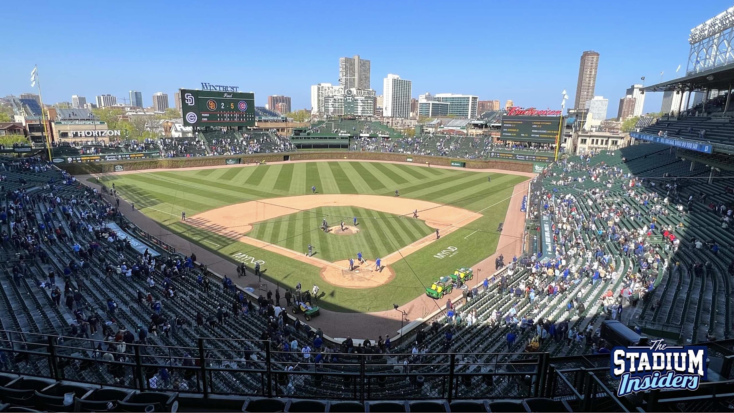 view of Wrigley field from behind home plate on the 300 level on a sunny clear day